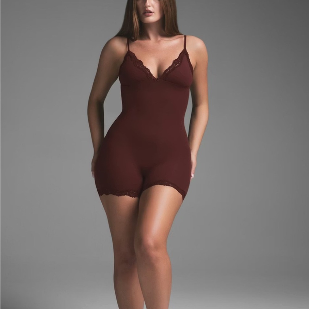 Skims Fits Everybody Lace Triangle Onesie in Oxblood